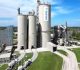 Holcim sufrió la combinación entre menores ingresos, mayores costos operativos y cargos por desvalorización de activos, en el primer trimestre.